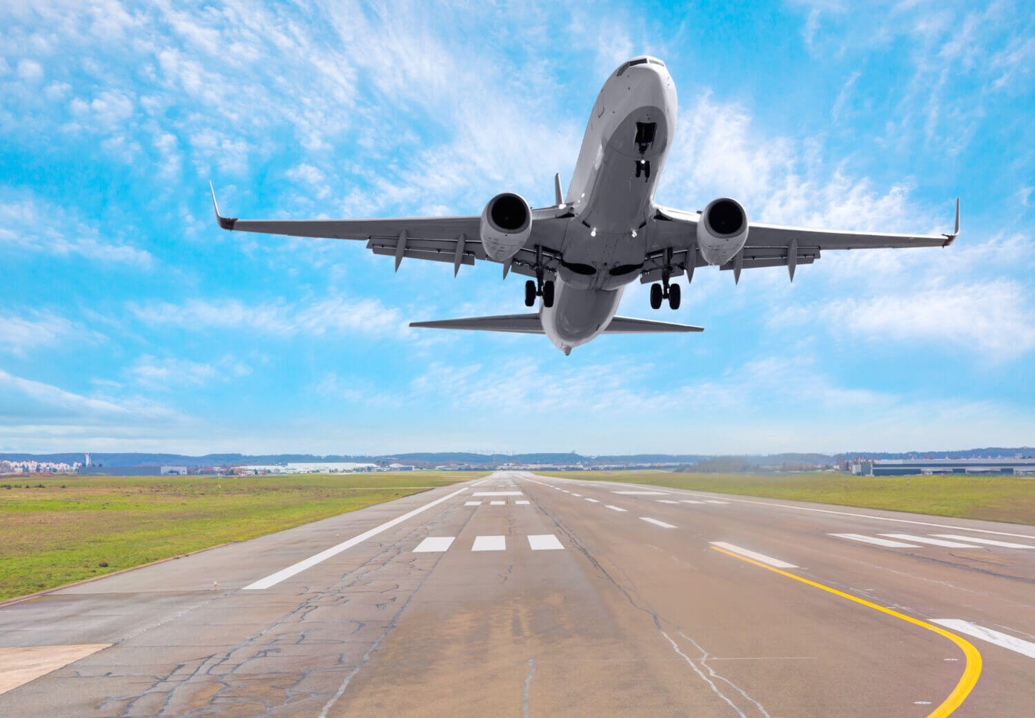 An airplane landing on a runway, symbolizing travel and arrival at the health and fitness retreat